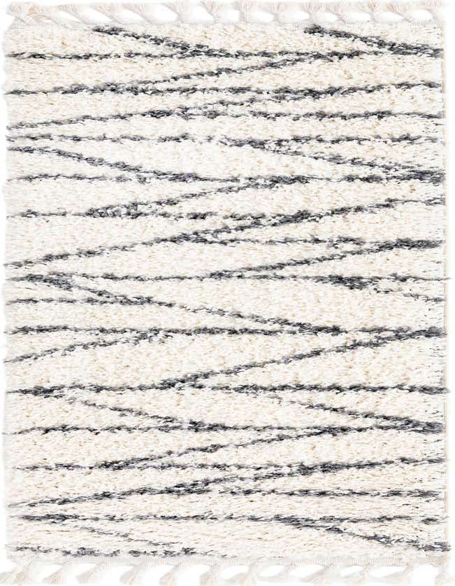 A 6 ft runner rug featuring a plush white shag pile with textured gray abstract stripe patterns and decorative tassels.