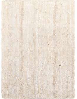 A 1' 2 x 10' 0 white braided jute runner rug with a textured, flatweave pattern, ideal for a hallway or kitchen.