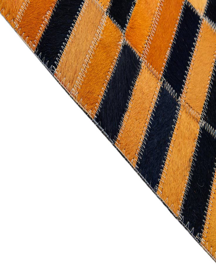 Detail image of  5' 1 x 7' 11 Cowhide - Patchwork Rug