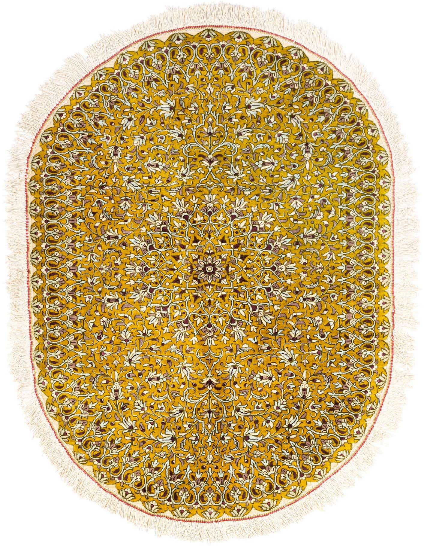 A 2x3 rectangular Ghom Silk rug with a traditional Persian floral pattern in yellows, golds, and muted white, featuring fringe.