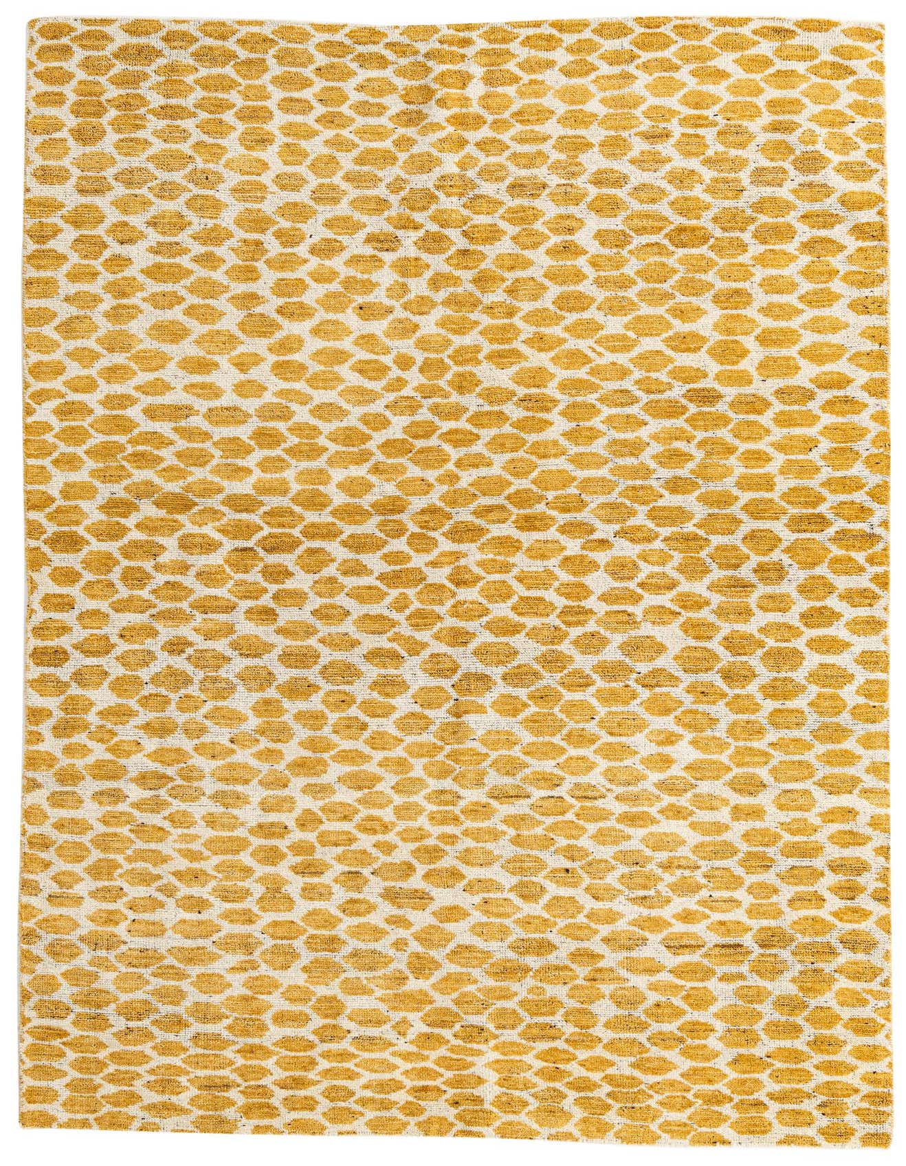 A 6x9 rectangular yellow and cream tribal shag rug with an abstract honeycomb pattern, perfect for a modern living room.
