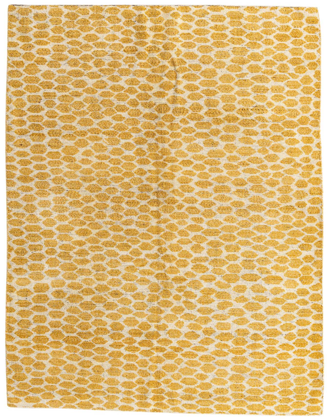 A 6x9 rectangular yellow and cream shag rug with an abstract tribal pattern, suitable for a living room.