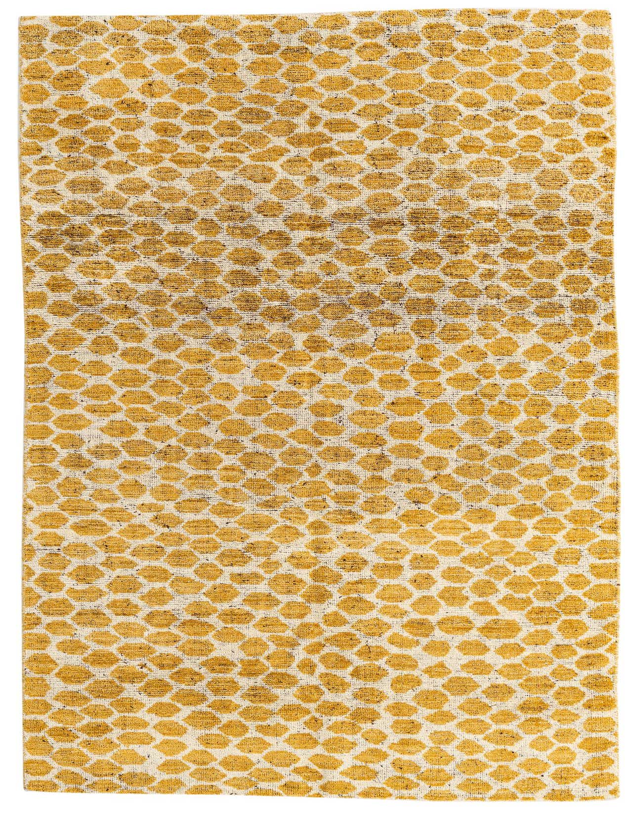 A 5x8 rectangular yellow and cream tribal shag rug with an abstract dotted pattern, suitable for a living room.