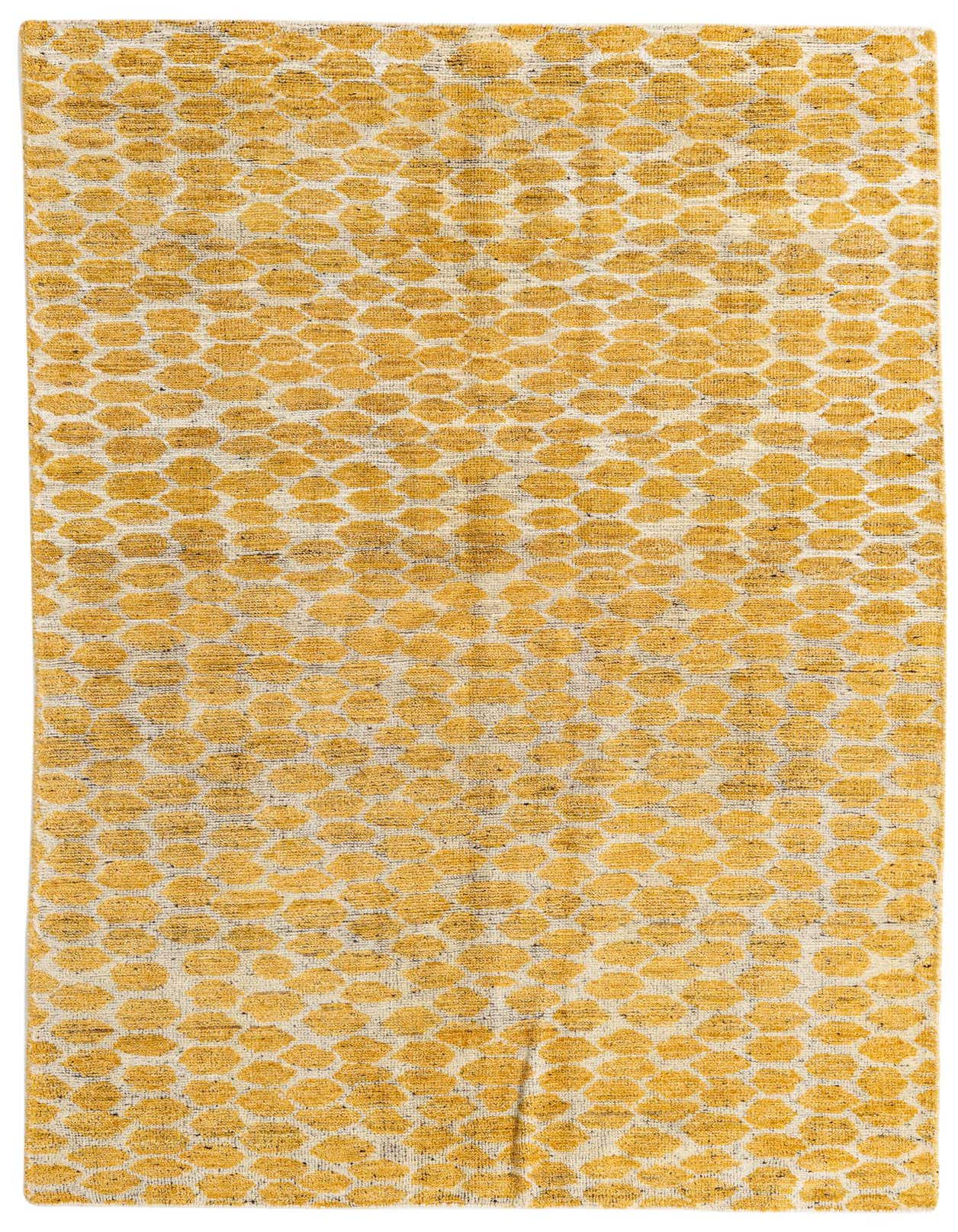 A 5x8 rectangular yellow and cream tribal shag rug with an abstract honeycomb pattern, perfect for a living room.