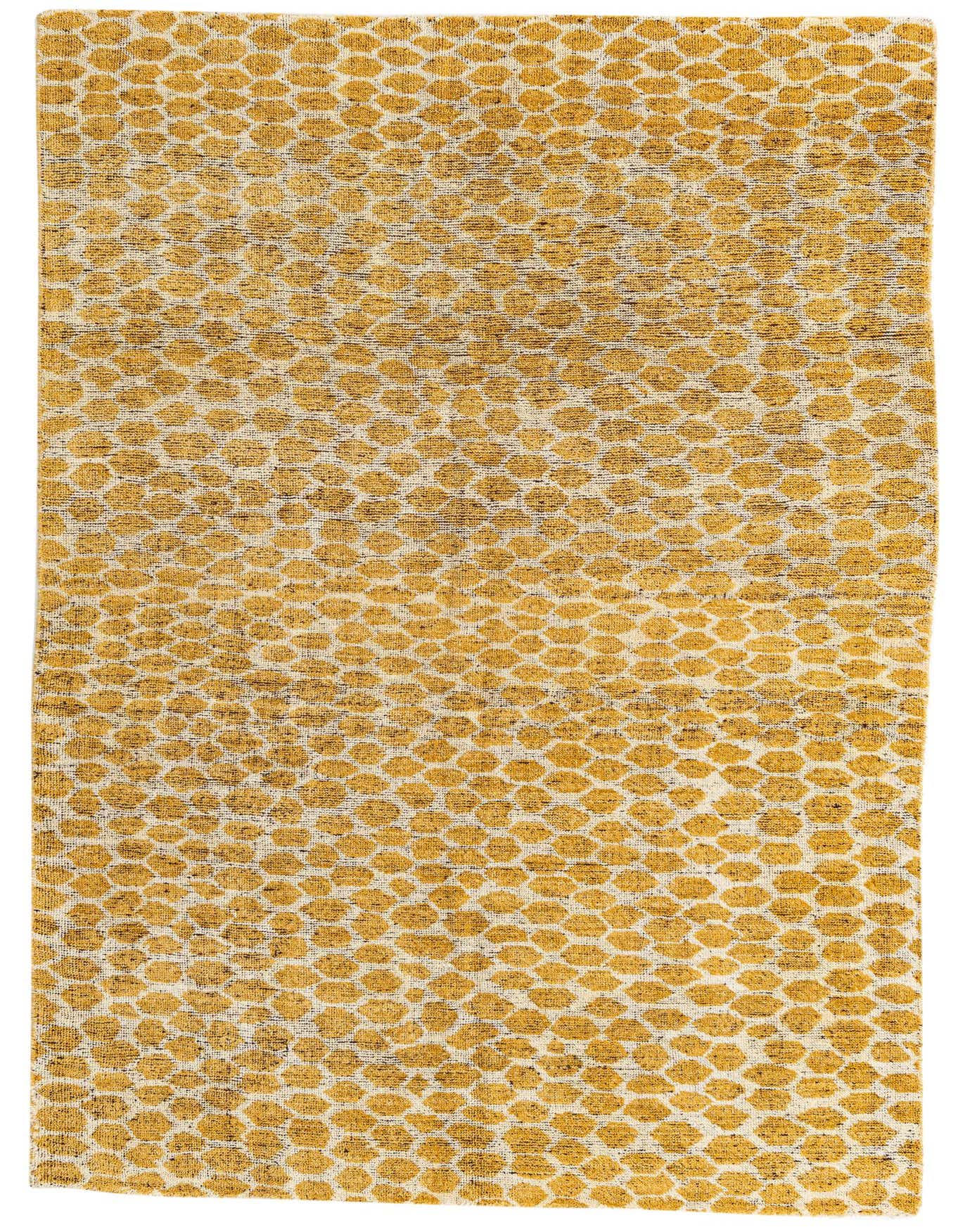 A 6x9 rectangular yellow and cream tribal shag rug with an abstract dotted pattern, perfect for a living room.