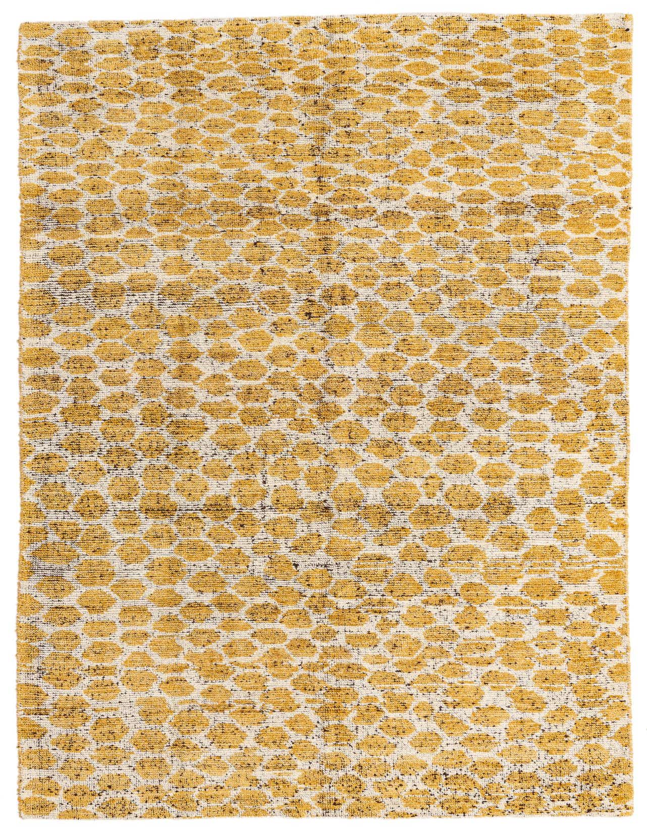 A 5x8 rectangular yellow and white tribal shag rug with an abstract dotted pattern, suitable for a living room.