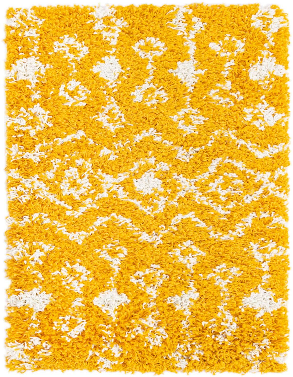 A rectangular 2x3 yellow shag rug with a white tribal pattern, showcasing its plush texture.