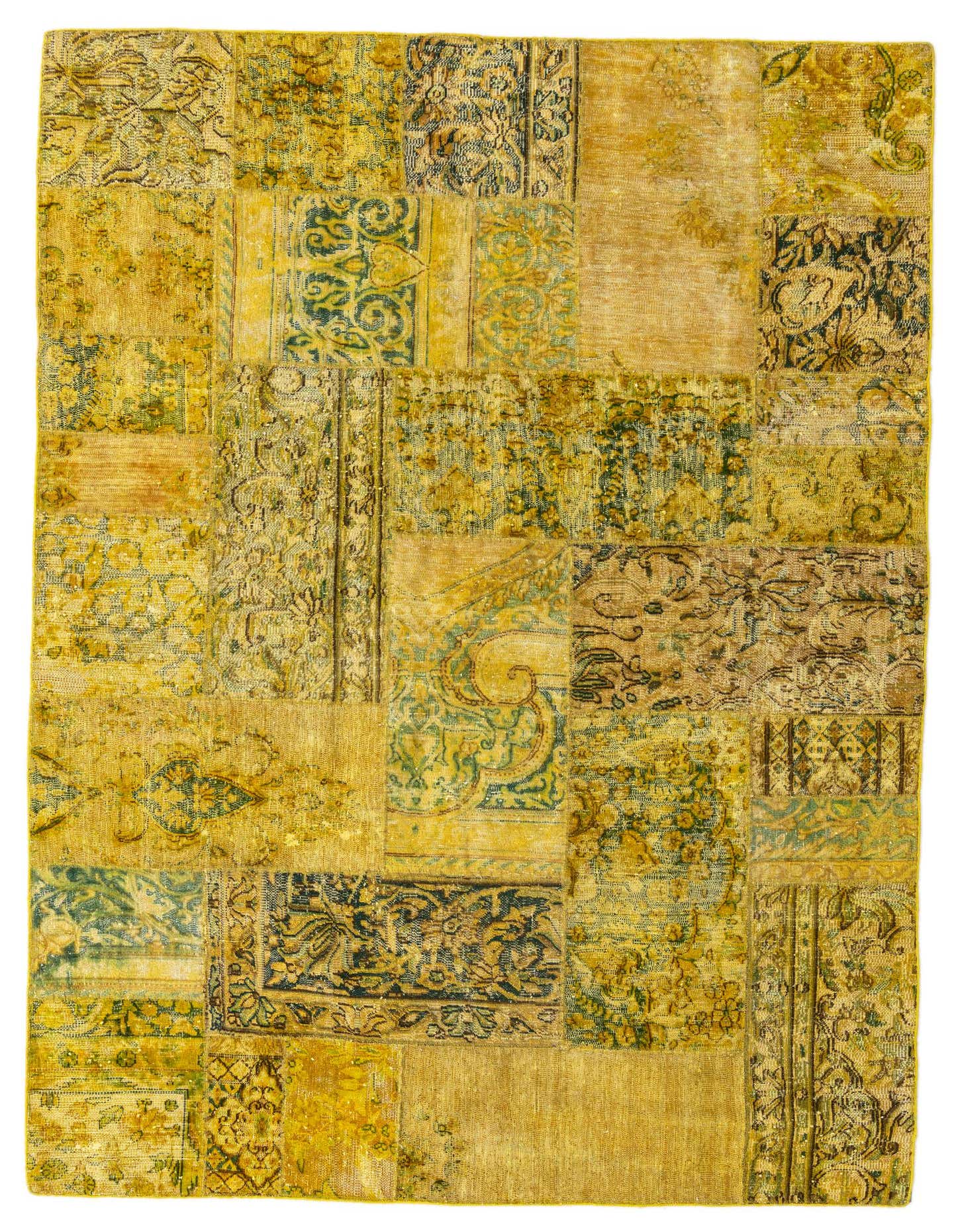 A 5x8 rectangular yellow and gold patchwork wool rug with various Persian, Southwestern, and abstract patterns.