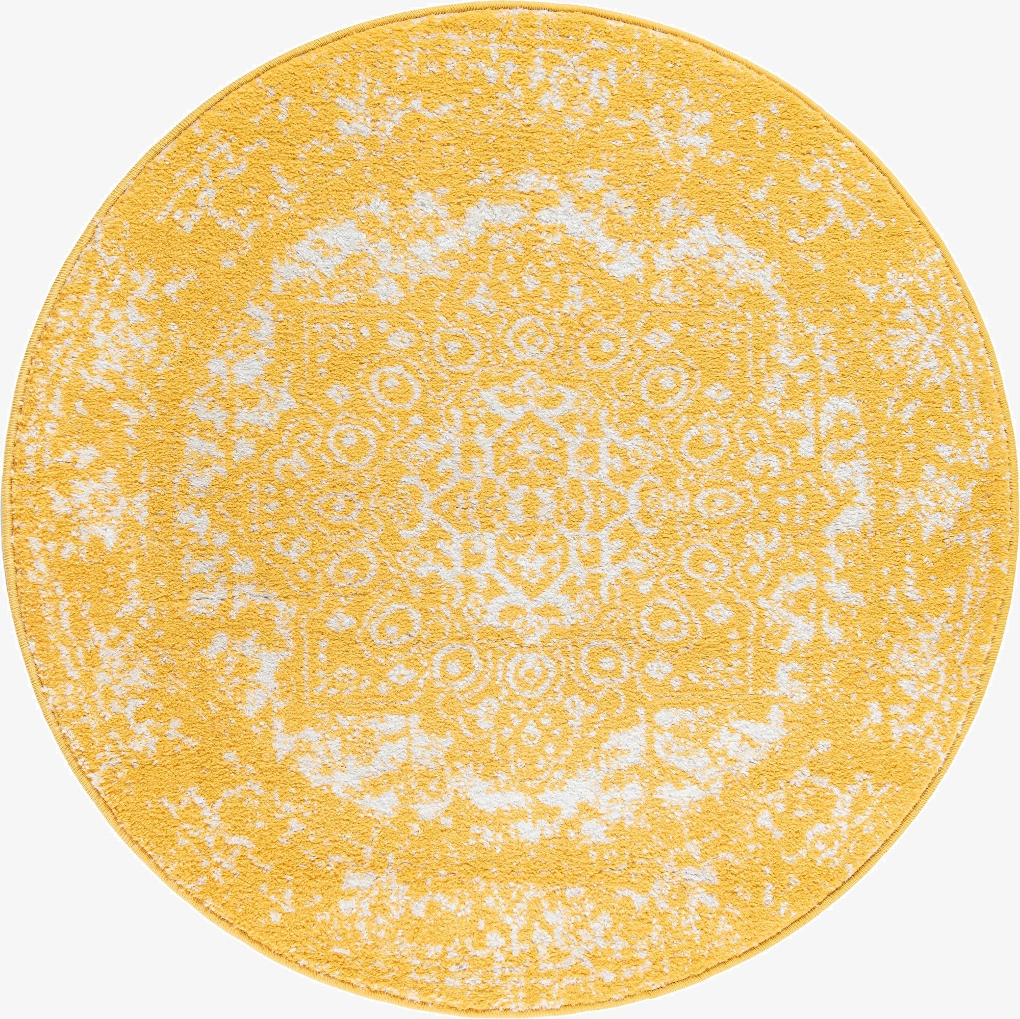 A 3-foot round yellow rug with a distressed white medallion pattern, suitable for adding a pop of color to any indoor space.