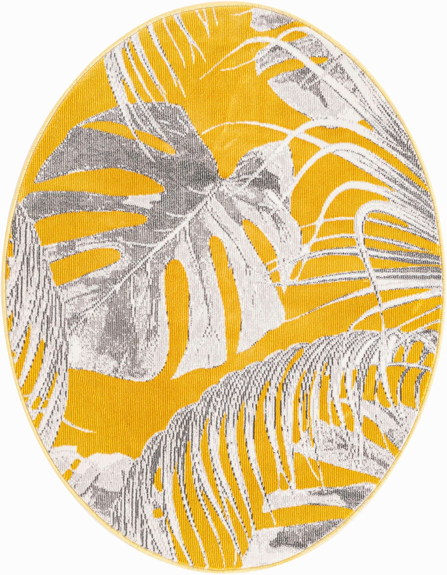 A round yellow rug with a modern floral pattern featuring large grey and white monstera and palm leaves.