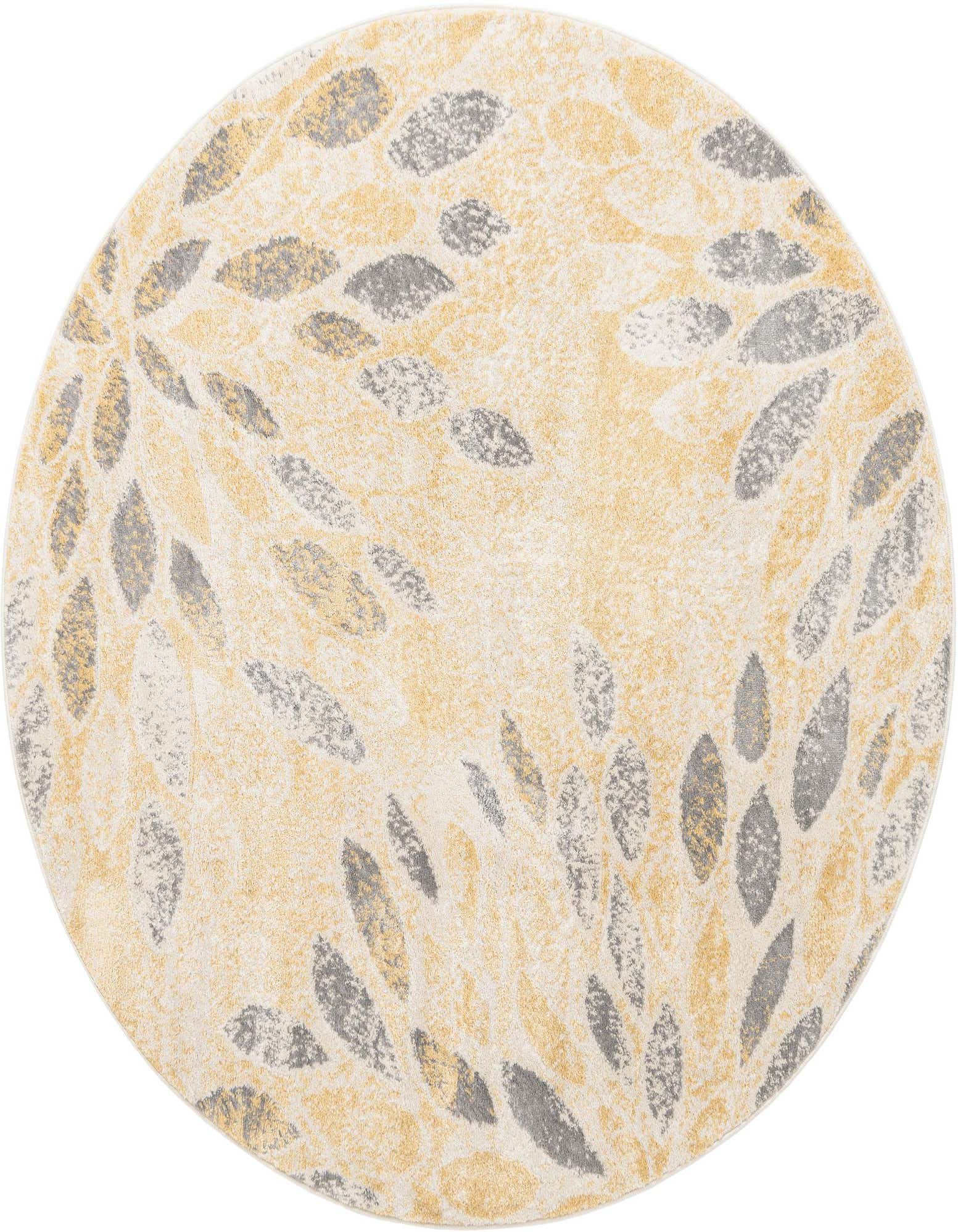 A round yellow and gold rug with a scattered leaf-like pattern in various shades of gray and white.