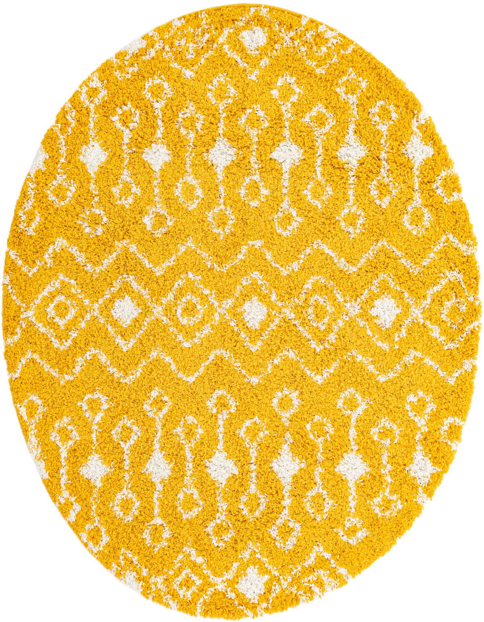 A 6' 0 round yellow shag rug with a white tribal geometric pattern, featuring diamonds and zigzags.