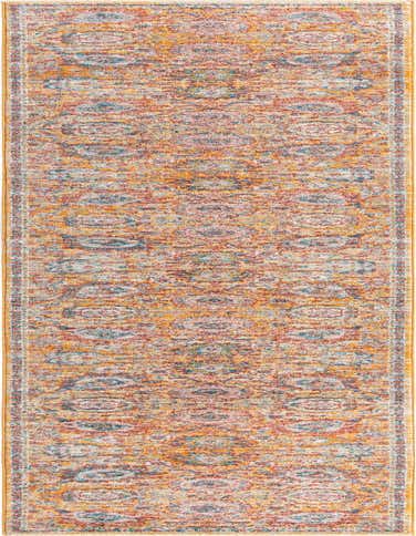 A 16 ft runner rug from the Lola collection, featuring a distressed traditional pattern in yellows, golds, and muted blues.