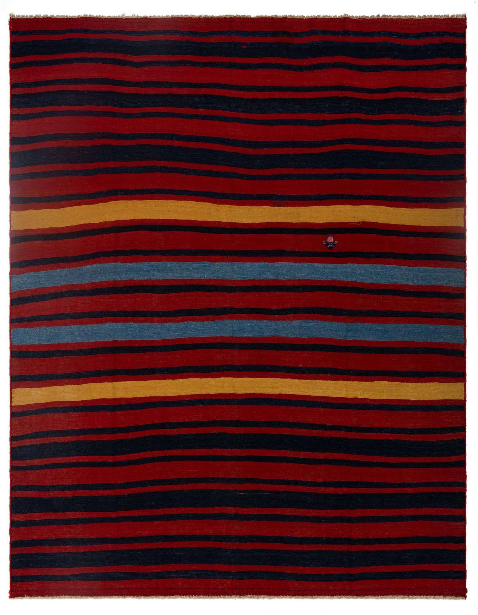 A square Armanibaff Kilim rug featuring horizontal stripes in varying widths of deep red, navy blue, yellow, and light blue, with a small embroidered detail.